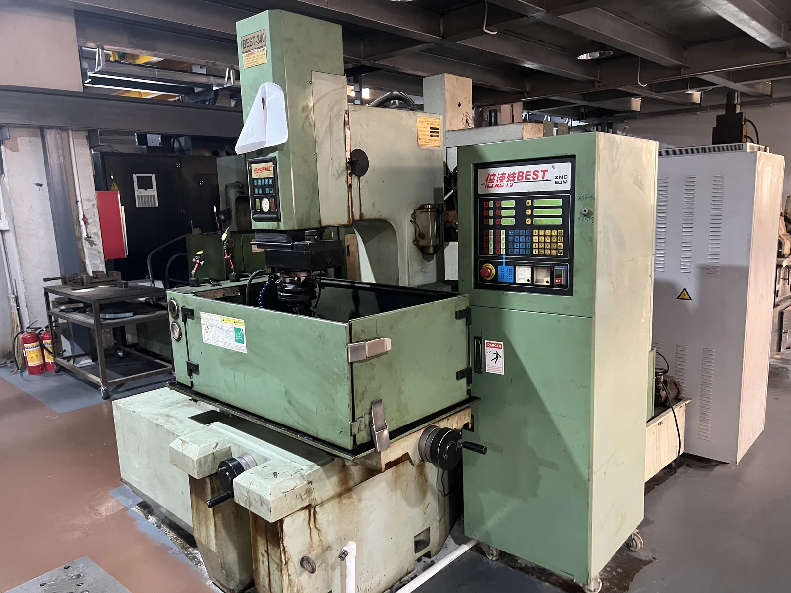 EDM machine used to cut forming dies for aluminum luggage panels