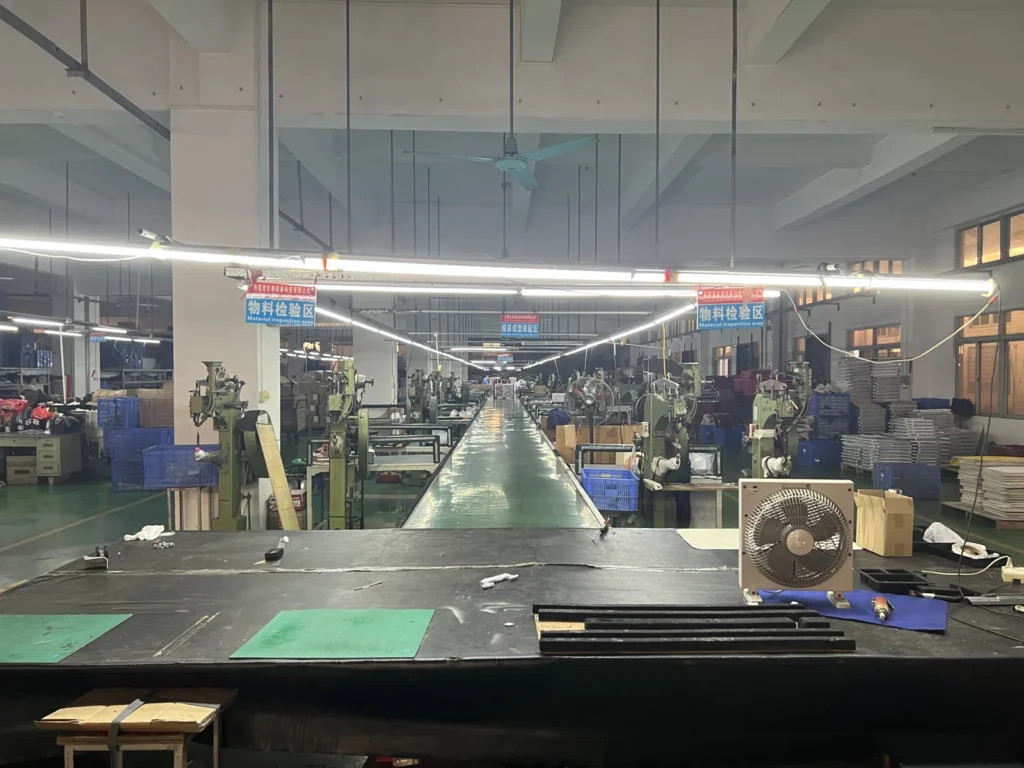 Assembly area where trolley handles are fitted into aluminum case shells