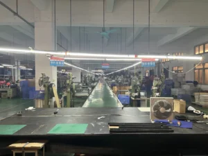 Assembly area where trolley handles are fitted into aluminum case shells