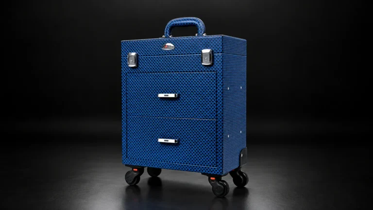 Blue textured makeup trolley case with drawers from the Aluvox factory, studio shot on black