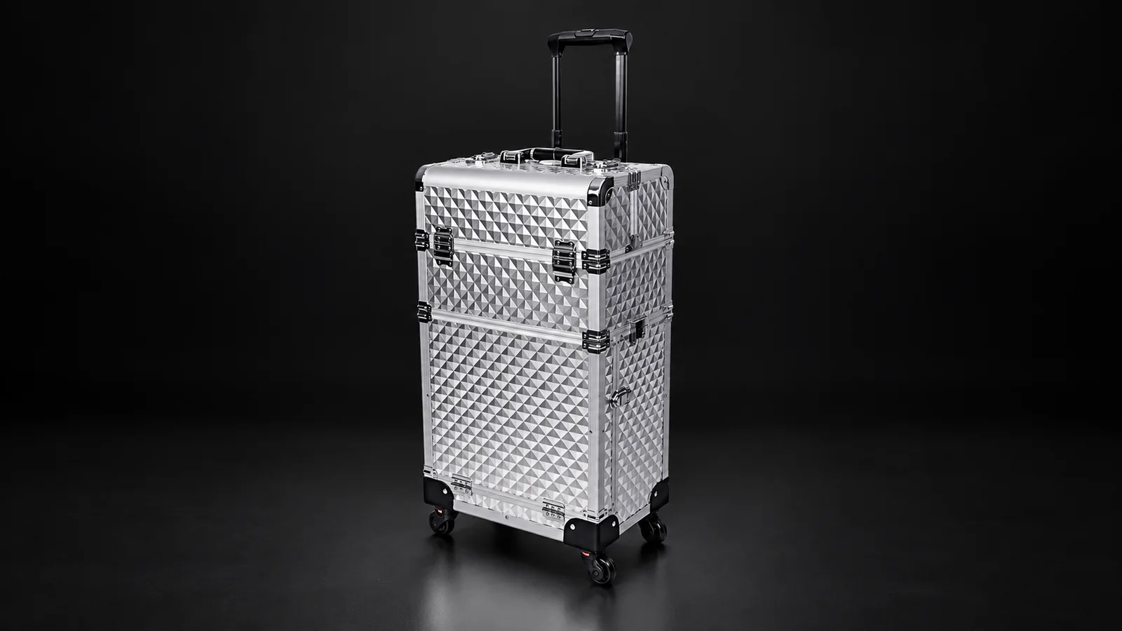 Silver diamond-textured aluminum trolley case from the Aluvox factory, studio shot on black