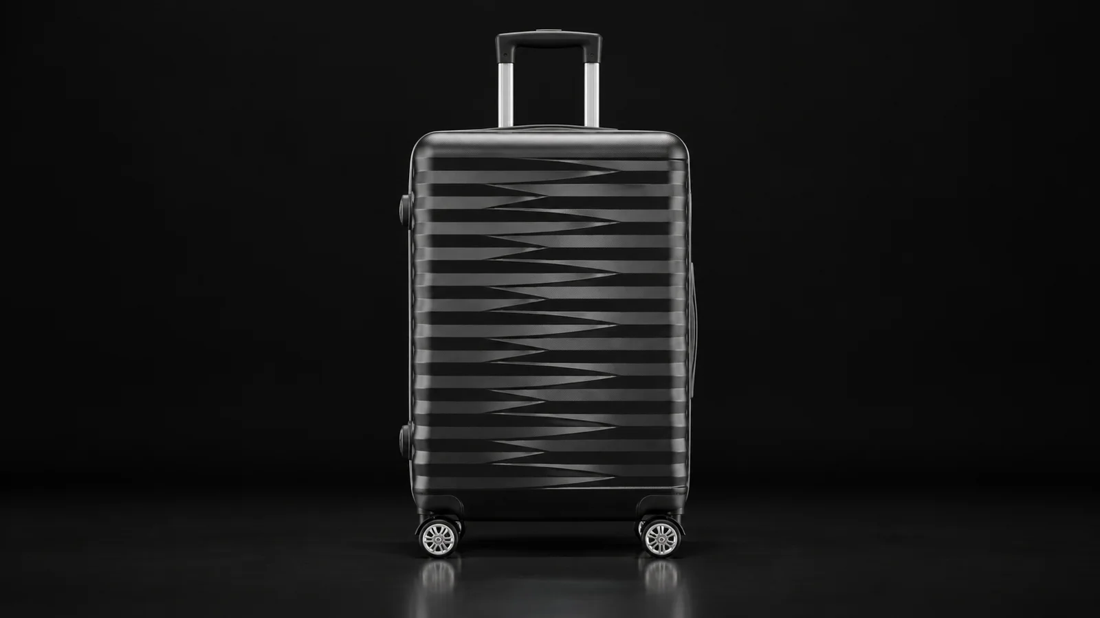 Dark grey polypropylene suitcase with diagonal grooves from the Aluvox range, studio shot on black