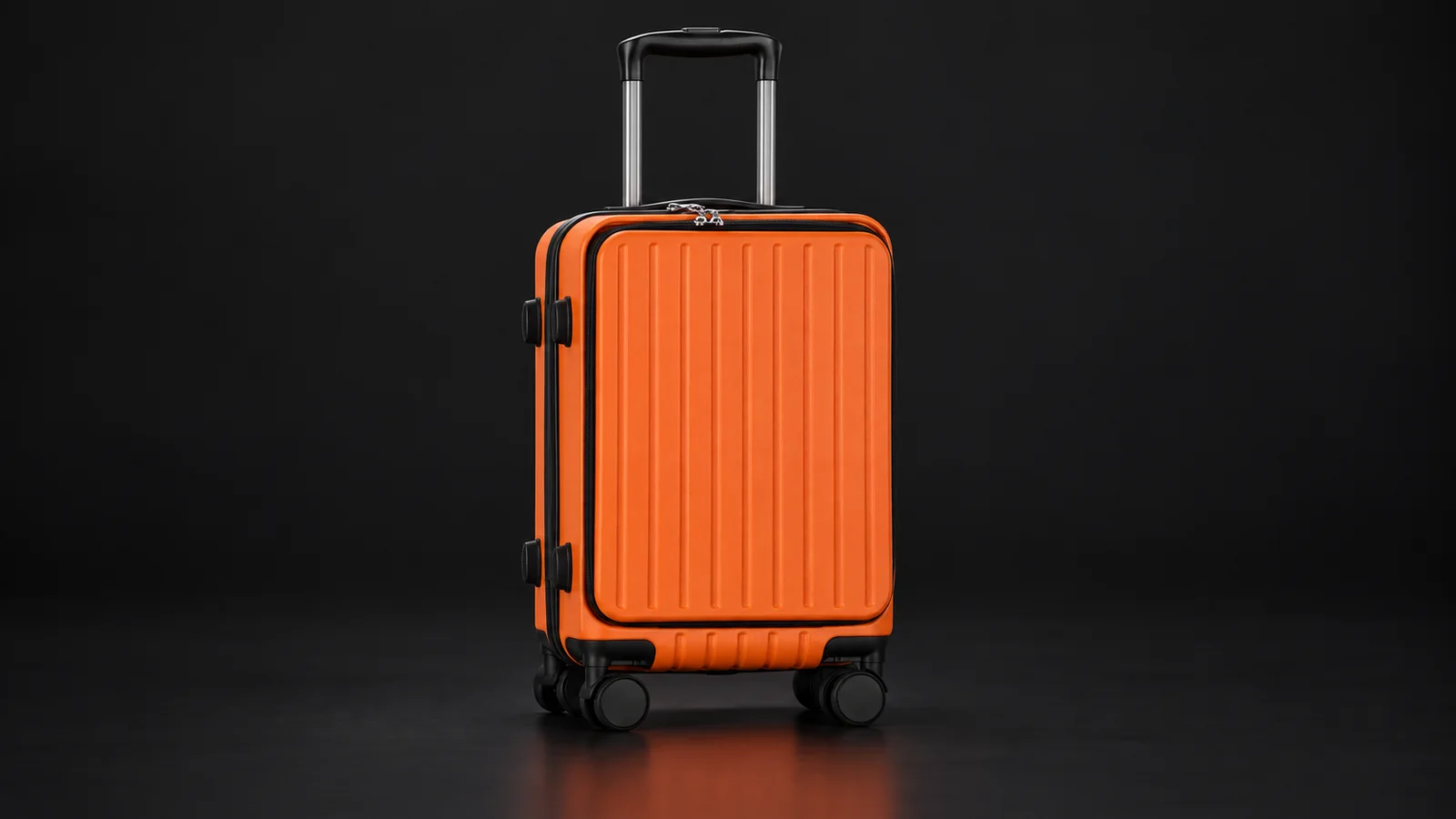 Orange ribbed front-opening suitcase from the Aluvox range, studio shot on black