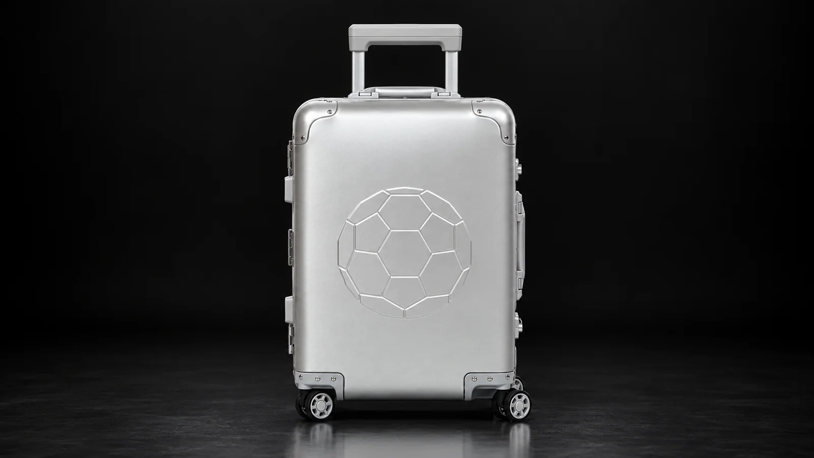 Silver aluminum suitcase with embossed pattern from the Aluvox factory, studio shot on black