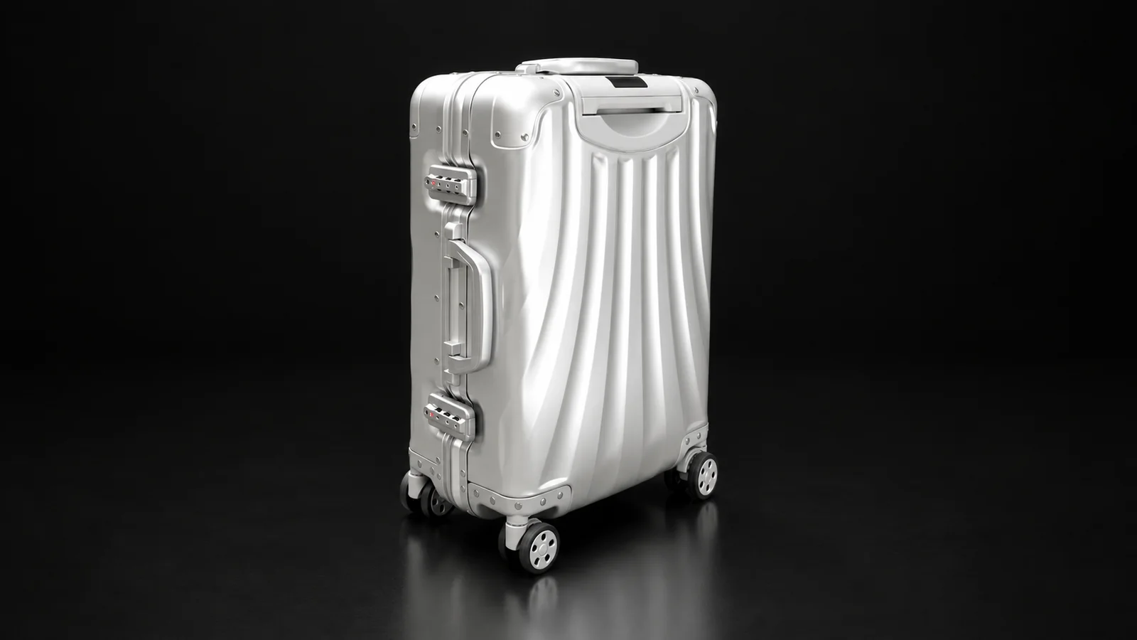 Silver wave-grooved aluminum frame suitcase from the Aluvox factory, studio shot on black