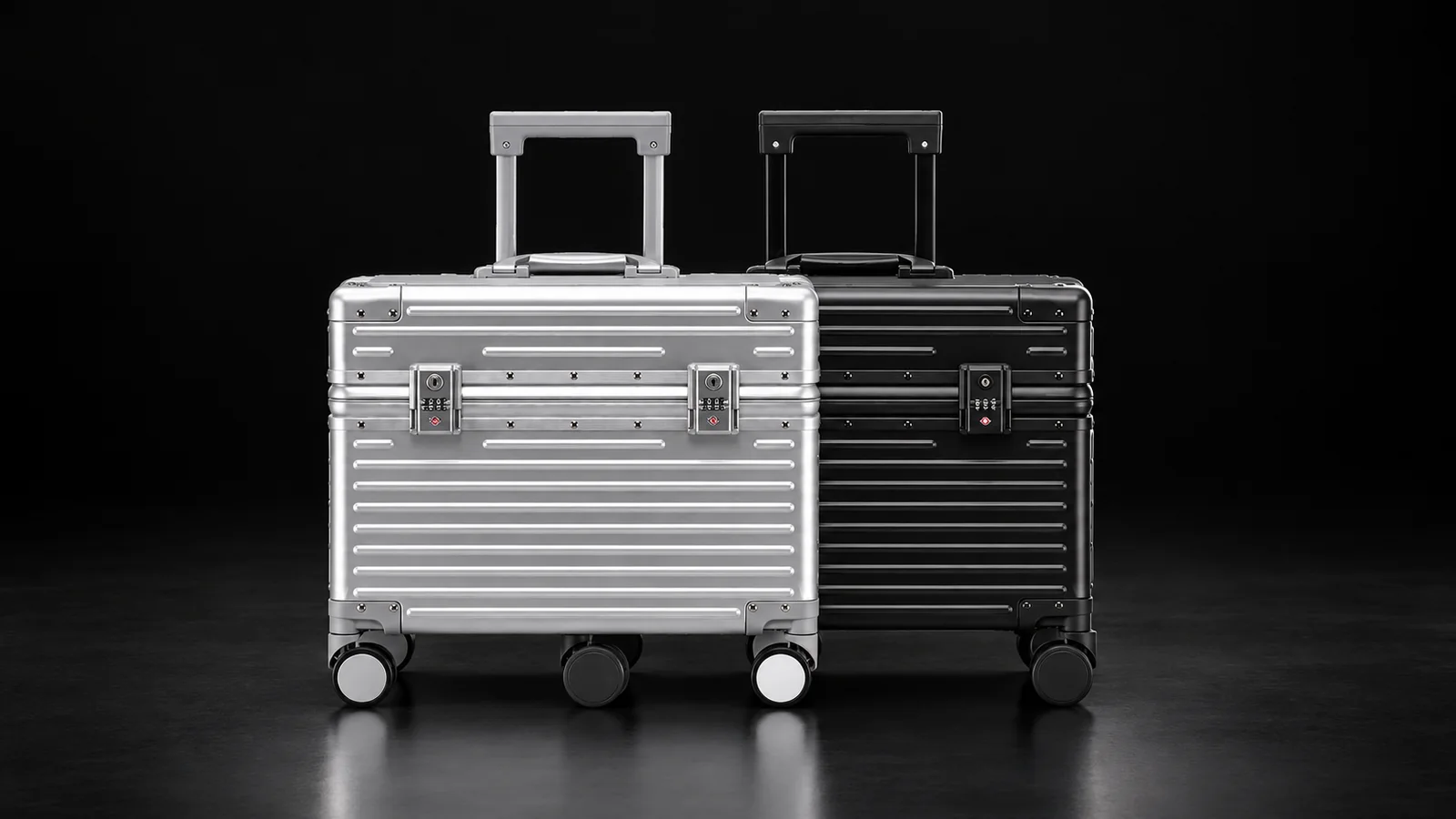 Silver and black ribbed aluminum pilot cases from the Aluvox factory, studio shot on black