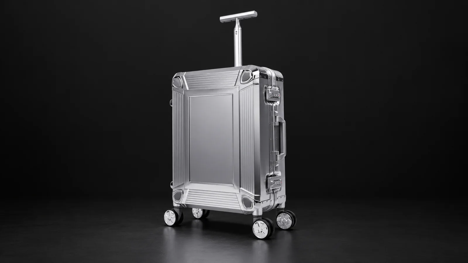 Smooth silver aluminum suitcase with single-post T-shaped handle from the Aluvox factory, studio shot on black