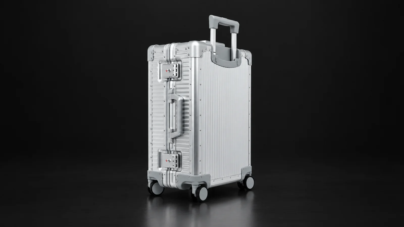 Silver ribbed aluminum carry-on suitcase from the Aluvox factory, studio shot on black