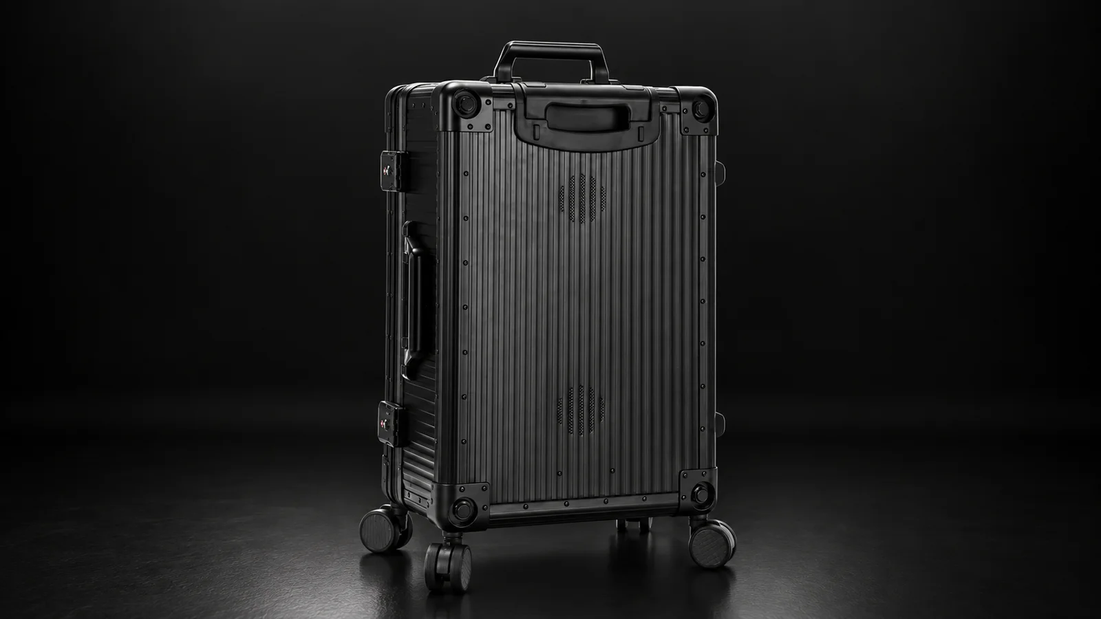 Black ribbed aluminum trolley case from the Aluvox factory, studio shot on black